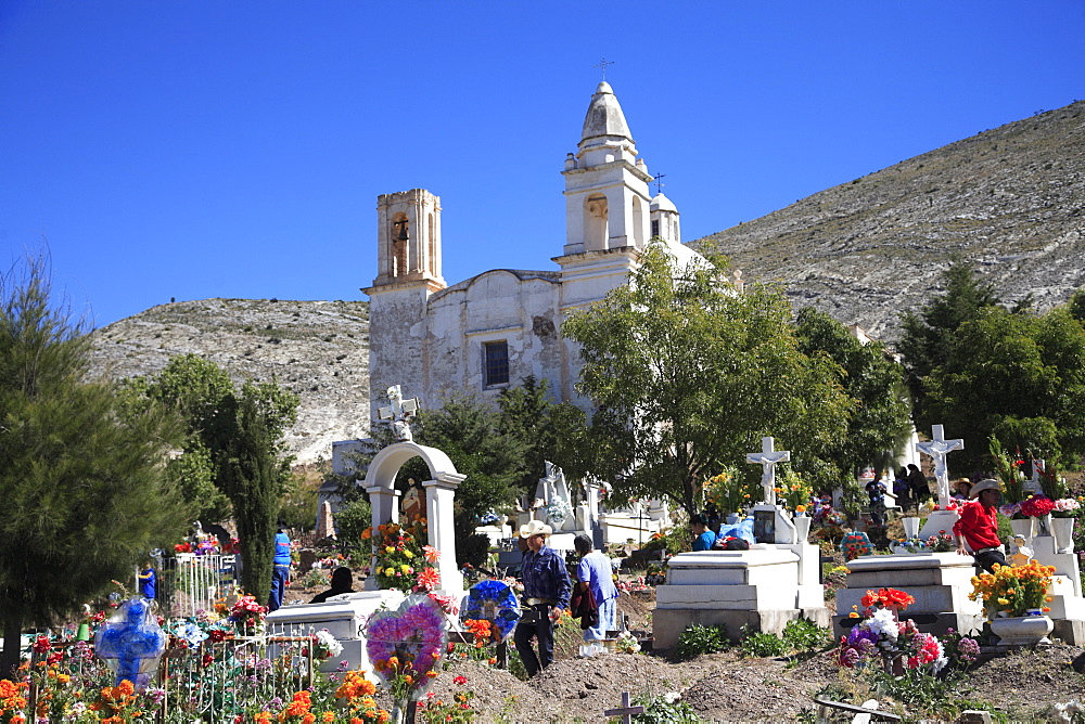 Families decorating graves for Day of the Dead, Templo de Guadalupe, Real de Catorce, former silver mining town, San Luis Potosi state, Mexico, North America


