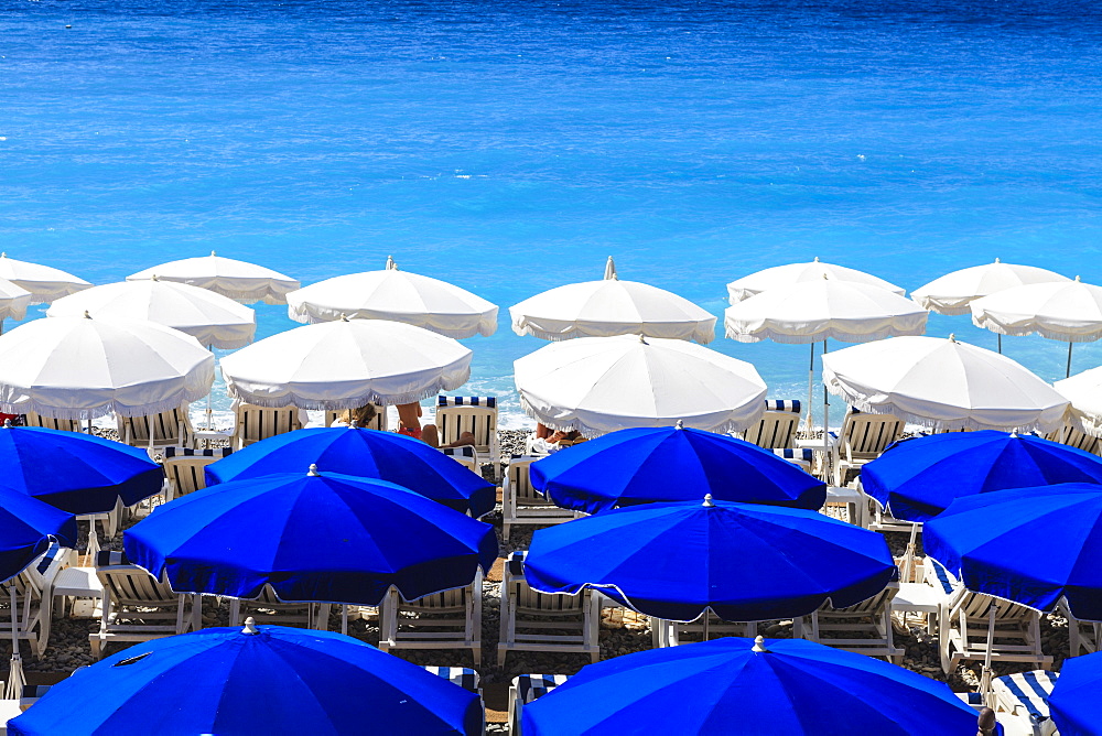 Beach parasols, Nice, Alpes Maritimes, Provence, Cote d'Azur, French Riviera, France, Europe