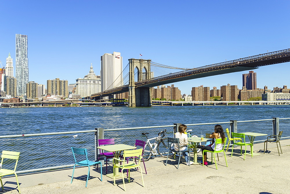 People enjoying the view of Brooklyn Bridge and the East River from Brooklyn Bridge Park, Brooklyn, New York City, New York, United States of America, North America