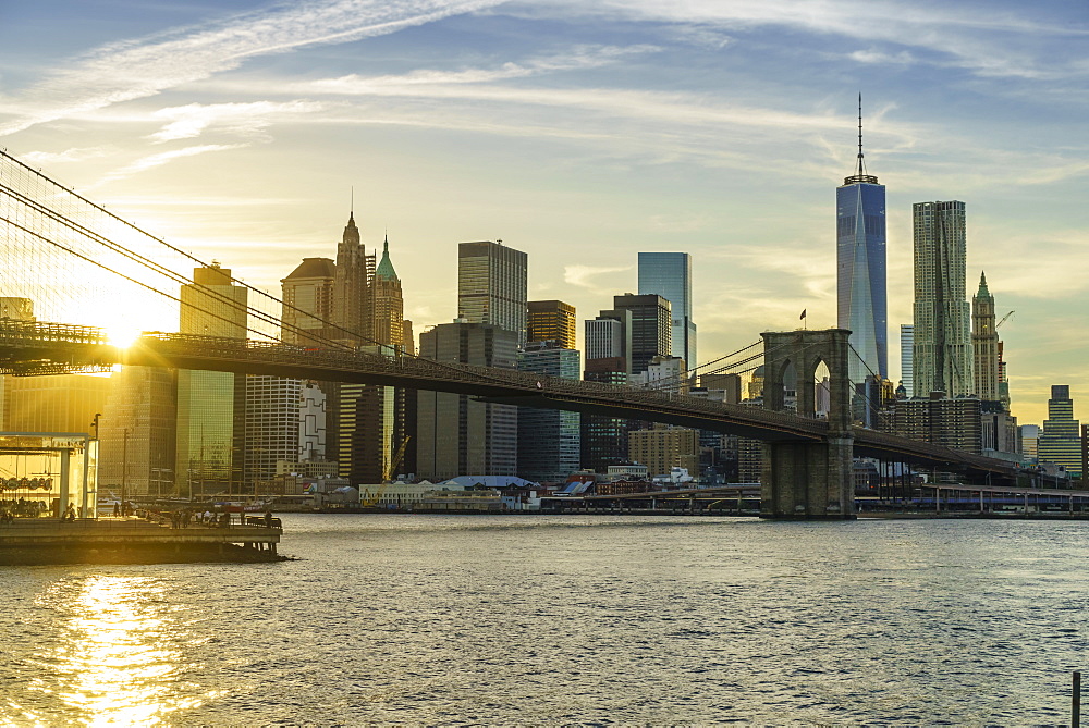 Brooklyn Bridge and Lower Manhattan skyline at sunset, New York City, New York, United States of America, North America