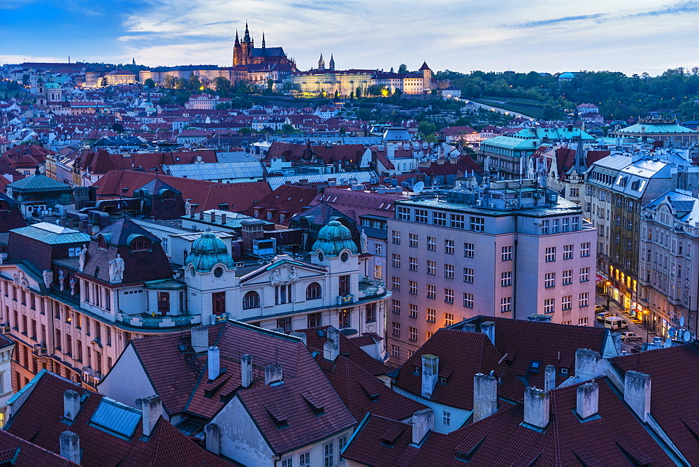 View over the Old Town rooftops towards St. Vitus's Cathedral at dusk, UNESCO World Heritage Site, Prague, Czech Republic, Europe