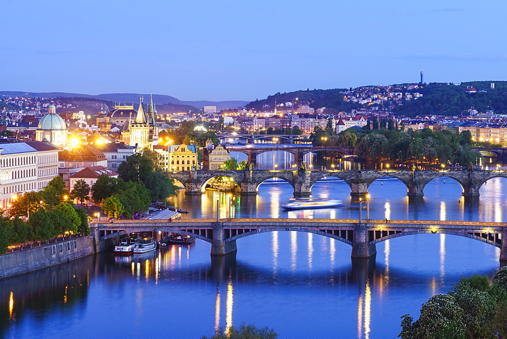 Looking down the Vltava River to Manesuv, Charles and Legii bridges connecting the Old Town to Mala Strana, Prague Castle and Hradcany, Prague, Czech Republic, Europe