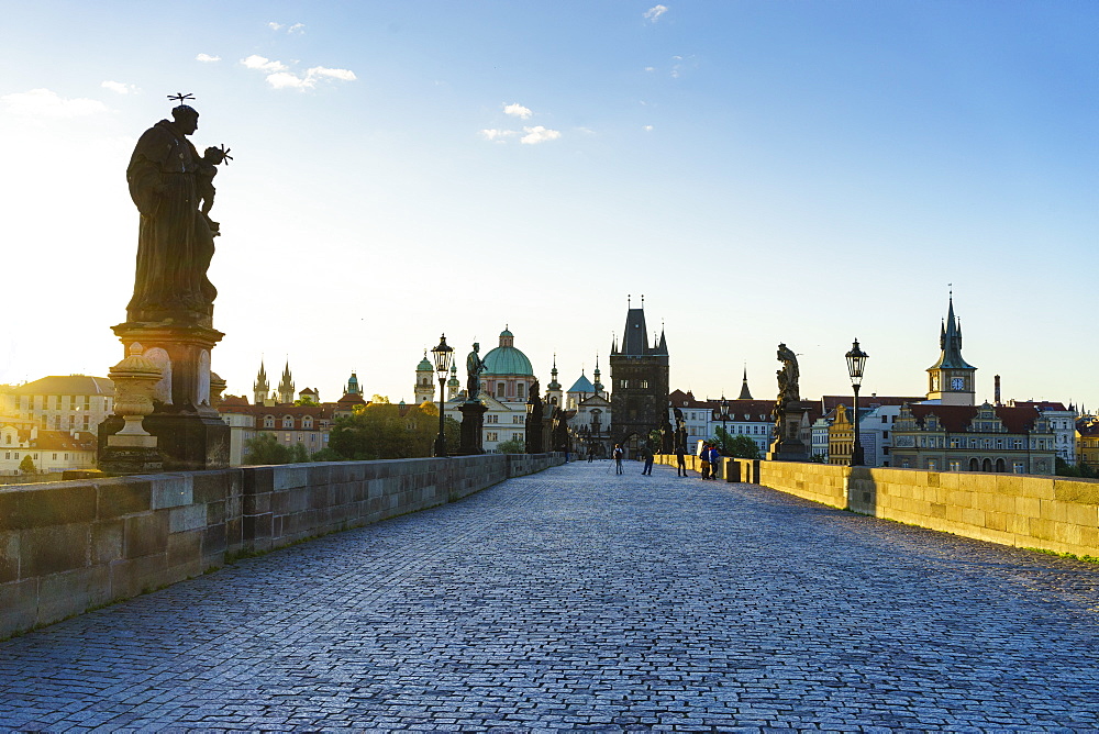 Early morning on Charles Bridge looking towards the Old Town, UNESCO World Heritage Site, Prague, Czech Republic, Europe