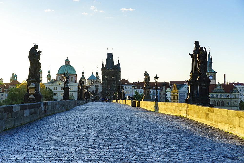 Early morning on Charles Bridge looking towards the Old Town, UNESCO World Heritage Site, Prague, Czech Republic, Europe