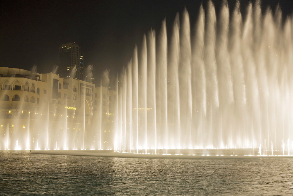 The Dubai Fountain, the largest of its kind in the world that shoots water 150 metres into the air to accompanying music and light show and stands in front of the Burj Khalifa, formerly the  Burj Dubai, Downtown Burj Dubai, United Arab Emirates, Middle East