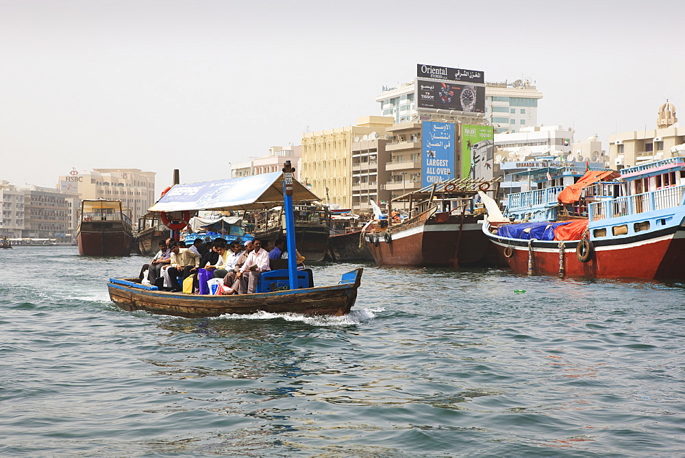 Abra water taxi crossing The Creek between Dur Dubai and Deira, Dubai, United Arab Emirates, Middle East