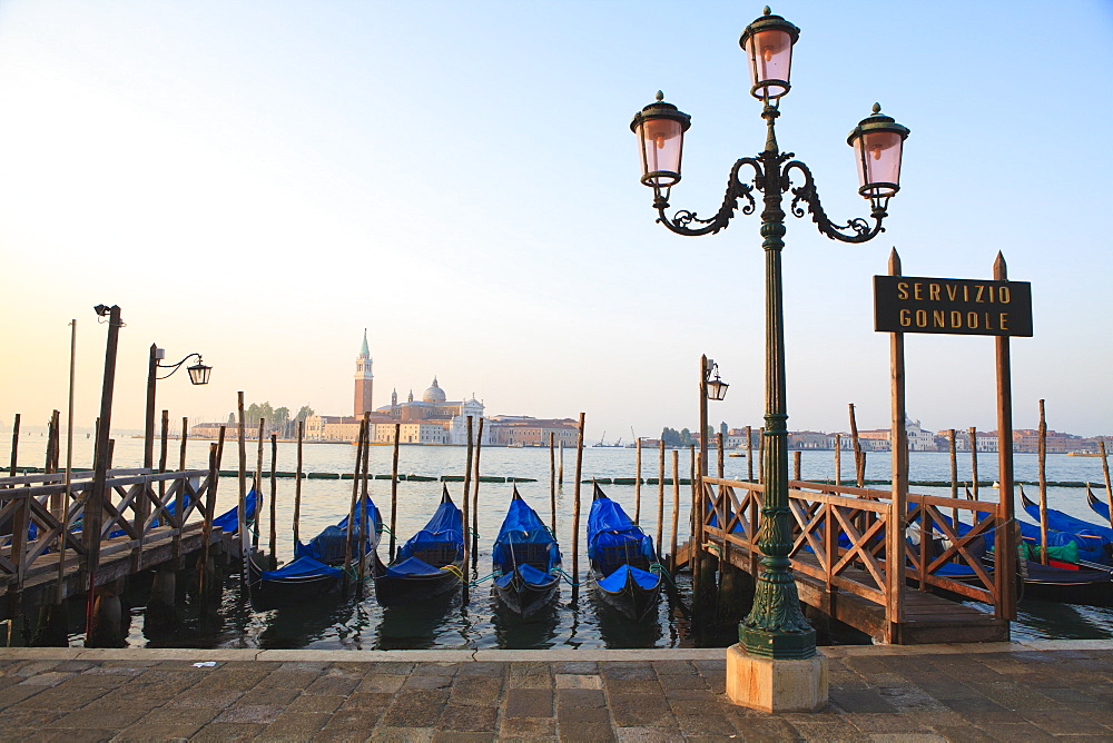 Gondolas moored by Riva degli Schiavoni, looking towards San Giorgio Maggiore, Venice, UNESCO World Heritage Site, Veneto, Italy, Europe