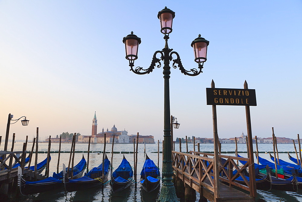 Gondolas moored by Riva degli Schiavoni, looking towards San Giorgio Maggiore, Venice, UNESCO World Heritage Site, Veneto, Italy, Europe