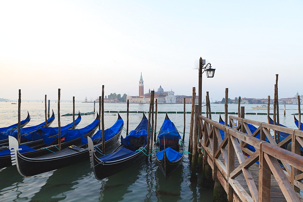 Gondolas moored by Riva degli Schiavoni, looking towards San Giorgio Maggiore, Venice, UNESCO World Heritage Site, Veneto, Italy, Europe