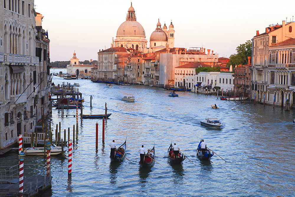 Gondolas on the Grand Canal, and view towards the domed church of Santa Maria Della Salute, Venice, UNESCO World Heritage Site, Veneto, Italy, Europe