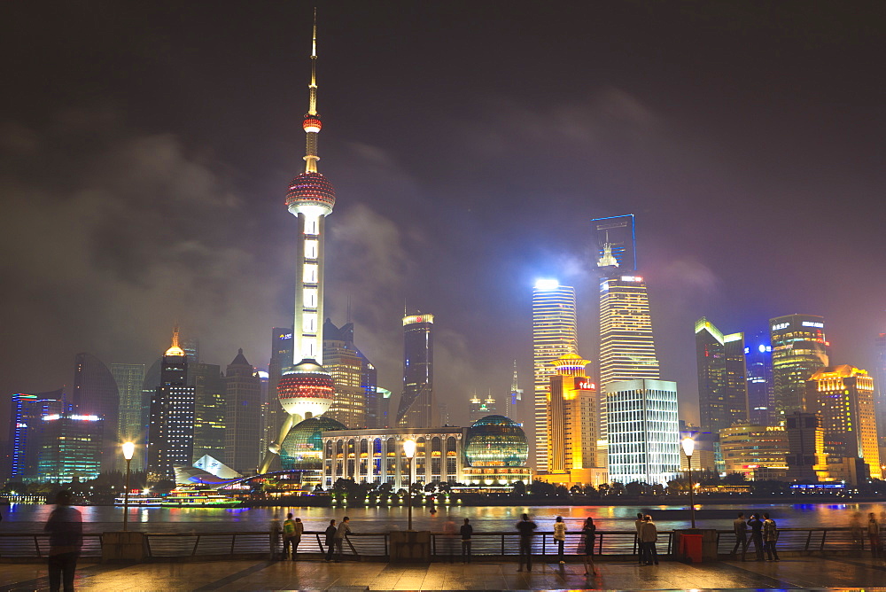 Pudong skyline at night across the Huangpu River, Oriental Pearl tower on left, Shanghai, China, Asia