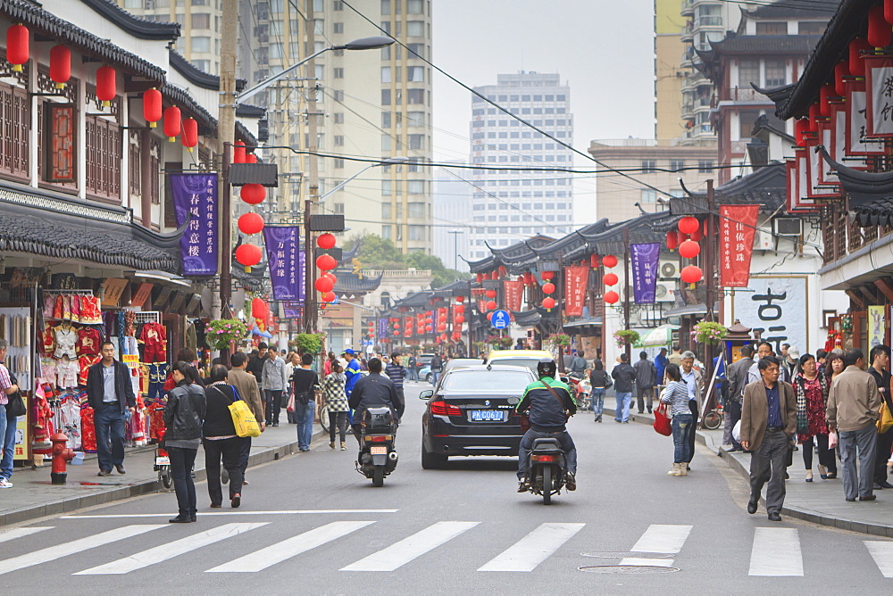 Pedestrians and traffic on Shanghai Old Street, remnant of a bygone age, Fuxing, Shanghai, China, Asia