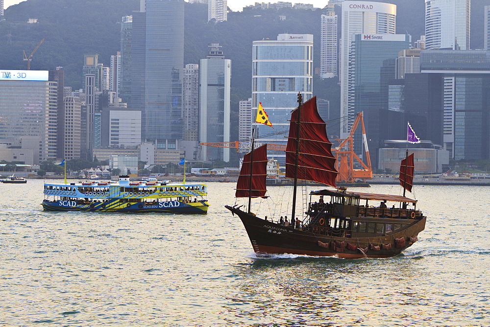 Star ferry and Chinese junk boat on Victoria Harbour, Hong Kong, China, Asia