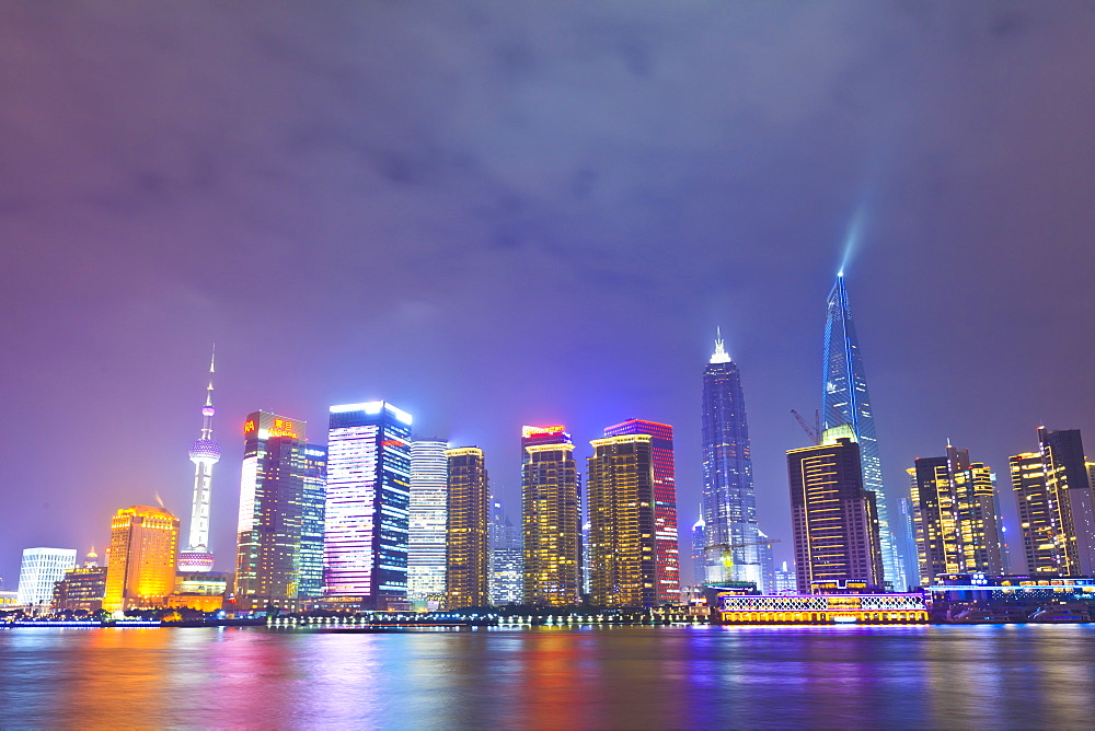 Pudong skyline at night across the Huangpu River, Shanghai, China, Asia