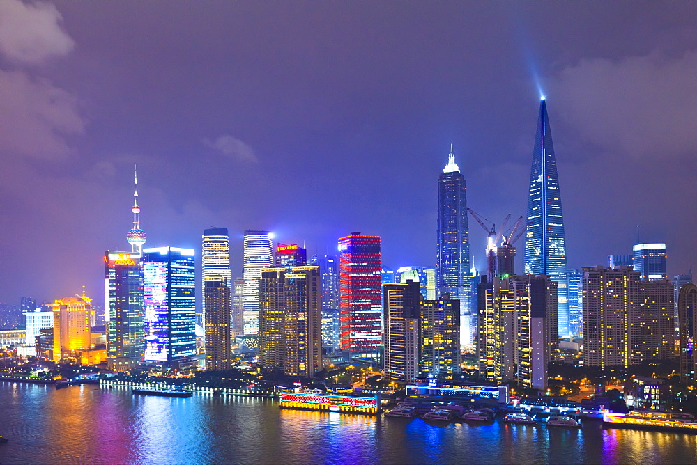 Pudong skyline at night across the Huangpu River, Shanghai, China, Asia