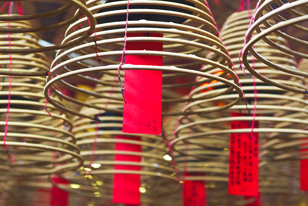 Incense coils and prayers written on red tags in the Man Mo Temple, Hong Kong, China, Asia