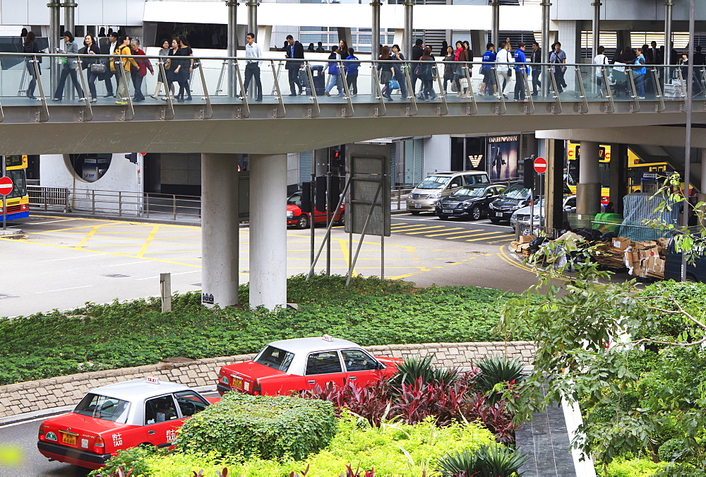 Commuters and taxis in Central, Hong Kong Island, Hong Kong, China, Asia