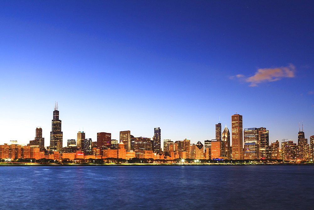 Chicago skyline and Lake Michigan at dusk with the Willis Tower, formerly the Sears Tower, on the left, Chicago, Illinois, United States of America, North America 