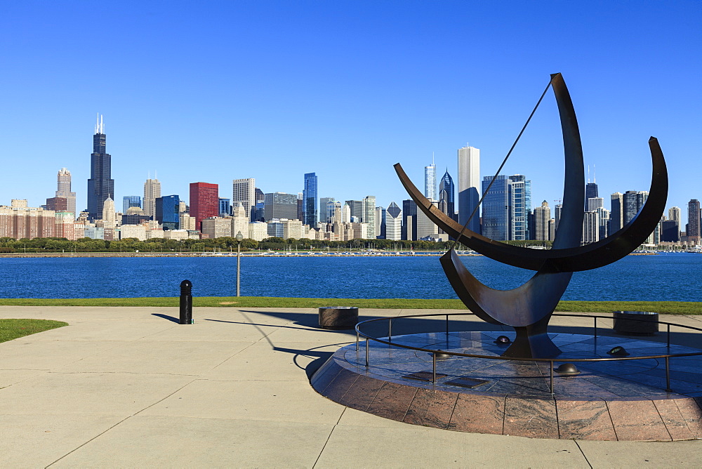 Chicago cityscape from Lake Michigan, the Adler Planetarium Sundial in the foreground with Willis Tower, formerly the Sears Tower beyond, Chicago, Illinois, United States of America, North America