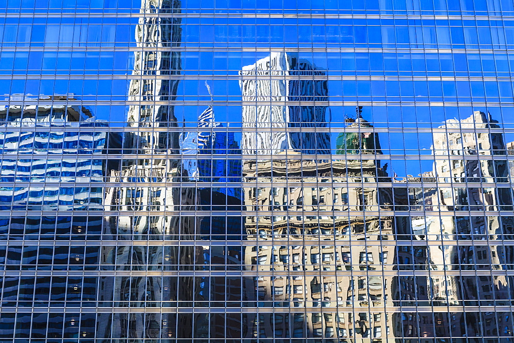 Buildings on West Wacker Drive reflected in the Trump Tower, Chicago, Illinois, United States of America, North America