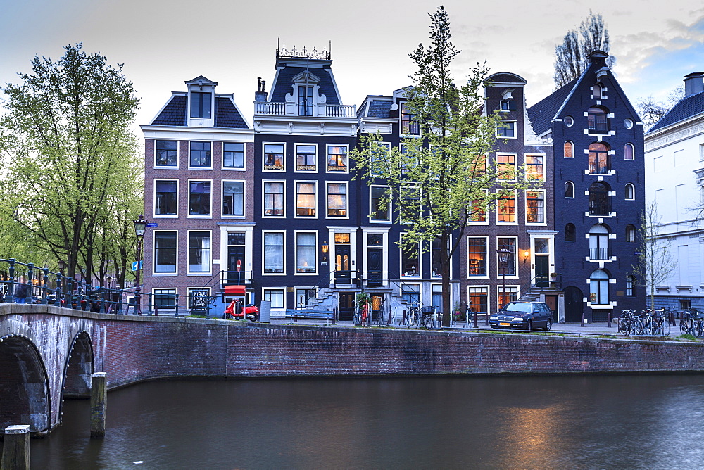 Old gabled houses line the Keizersgracht canal at dusk, Amsterdam, Netherlands, Europe 