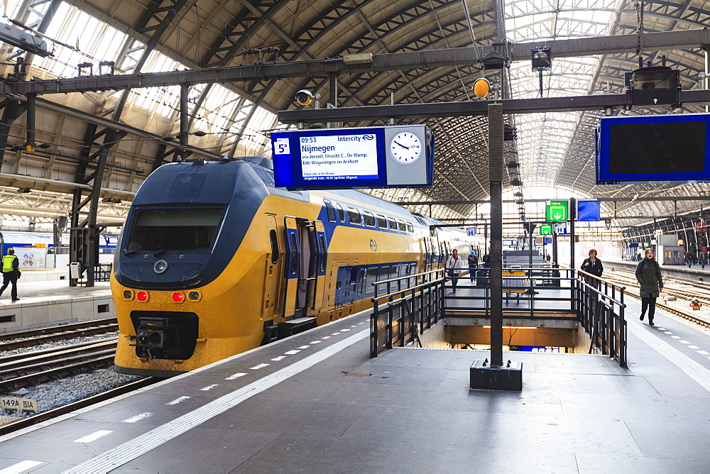 Intercity train in a platform at Central Station, Amsterdam, Netherlands, Europe 