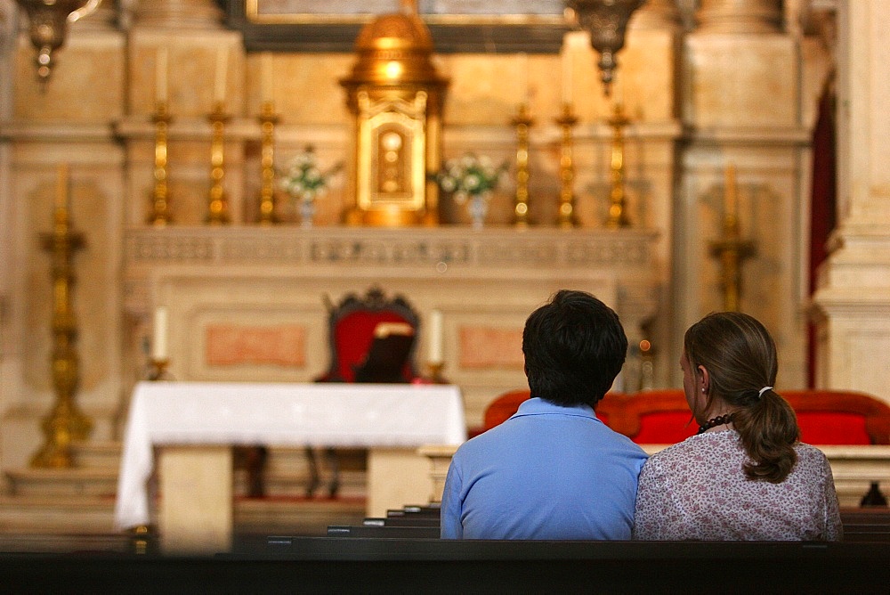 Catholic couple in church, Lisbon, Portugal, Europe