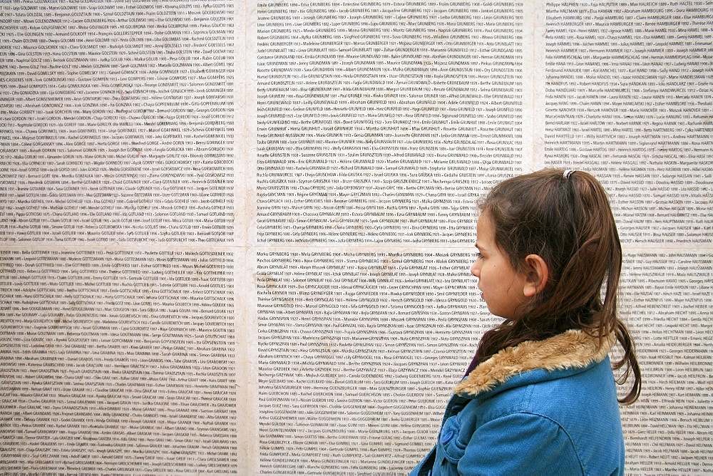 Girl at the Paris Holocaust memorial, Paris, France, Europe