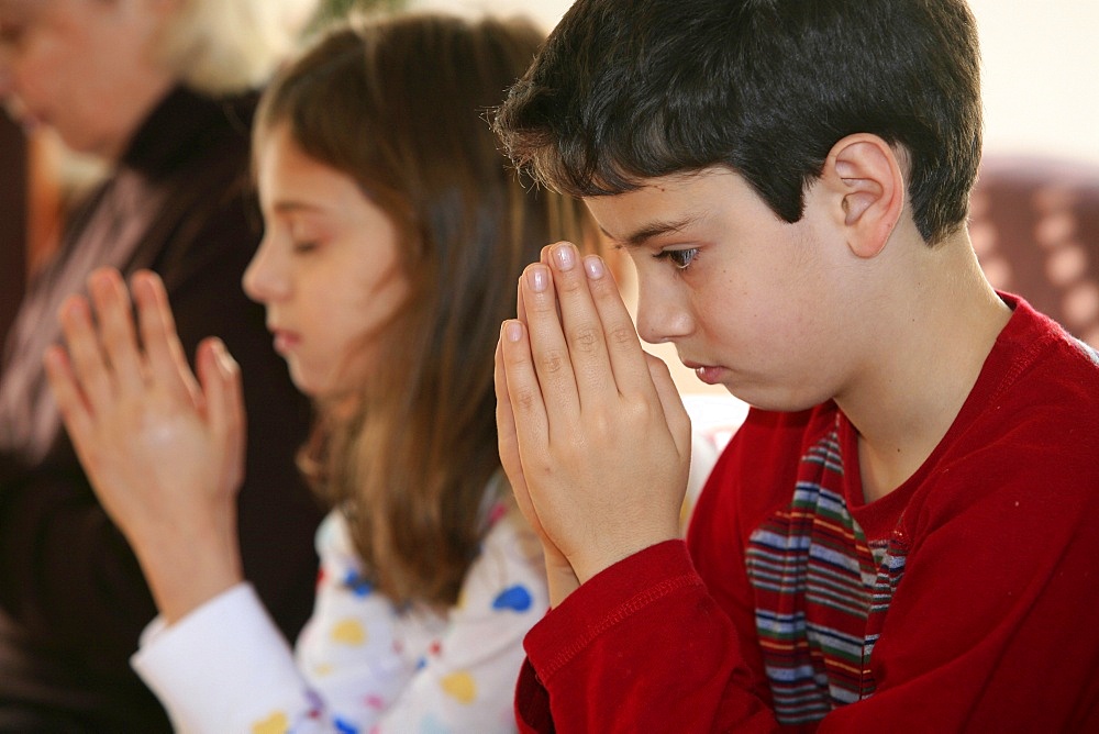 Family prayer, Paris, France, Europe