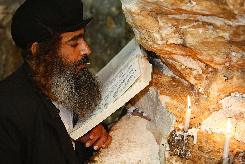 Woman praying in Elijah's cave Synagogue in Haifa, Israel, Middle East