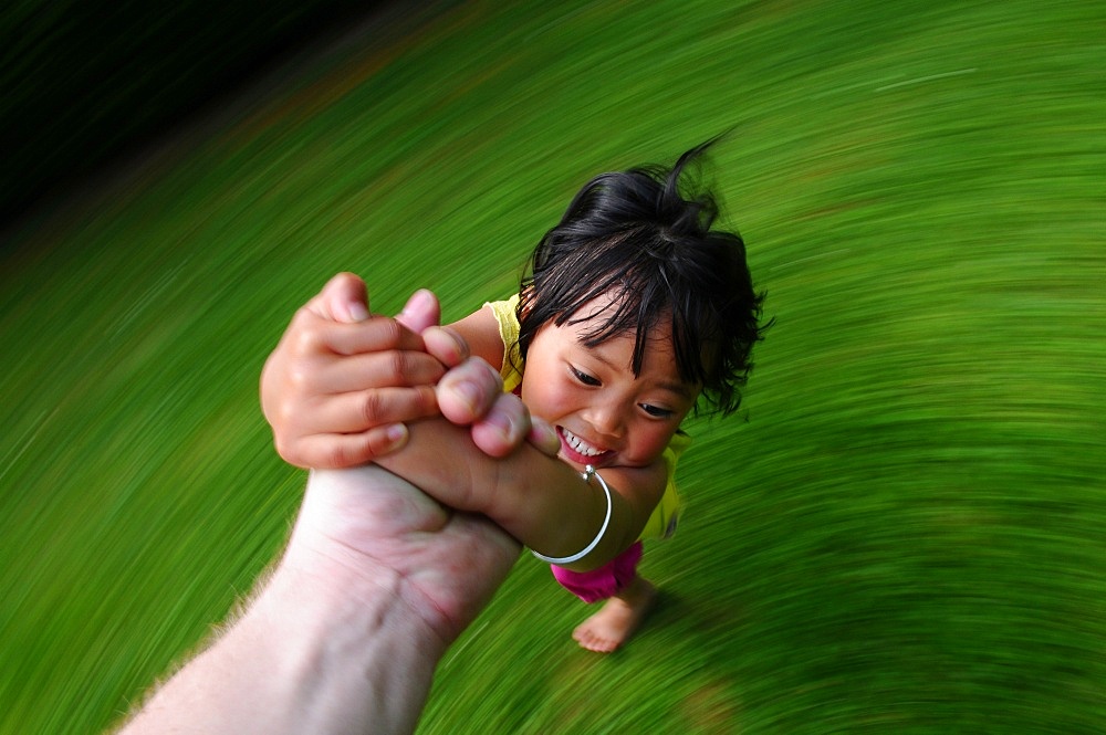 Child turning, Paris, France, Europe