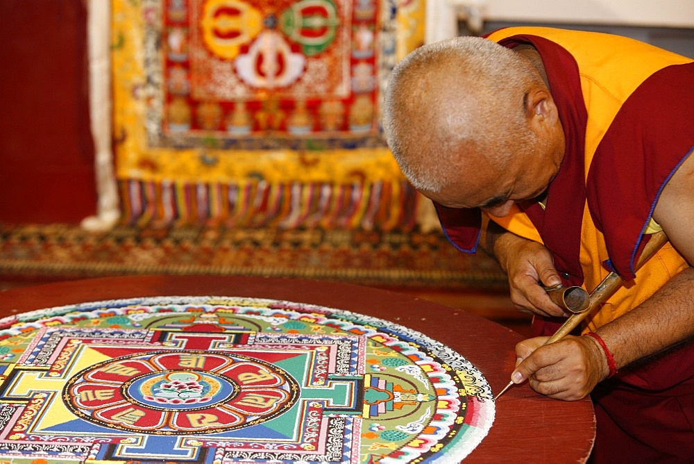 Buddhist monk drawing a mandala, Paris, Ile de France, France, Europe