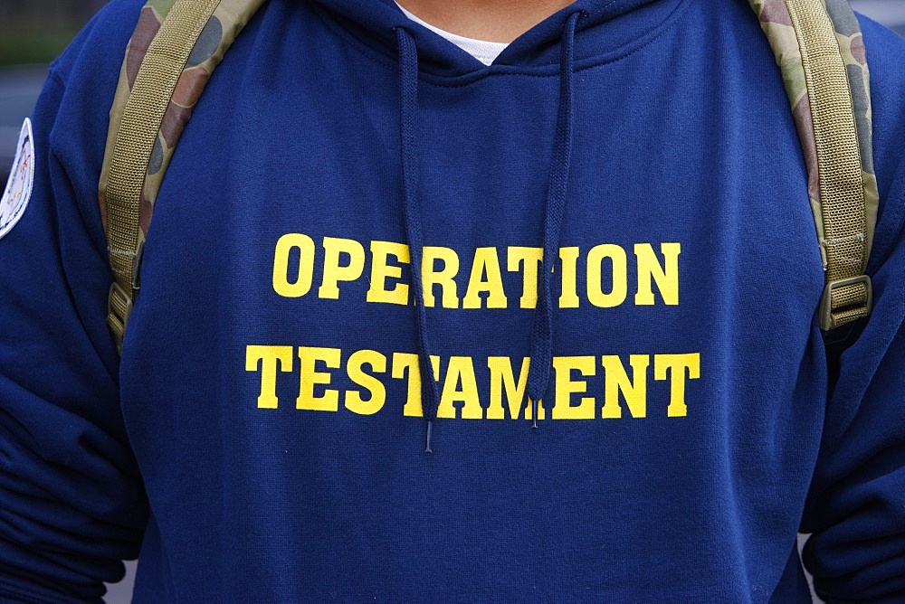 Operation Testament lettering on Catholic t-shirt, Sydney, New South Wales, Australia, Pacific