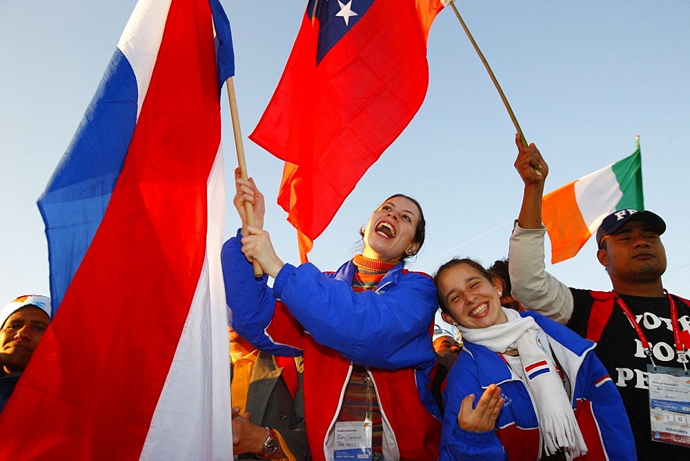 Young Catholics wave flags during World Youth Day, Sydney, New South Wales, Australia, Pacific