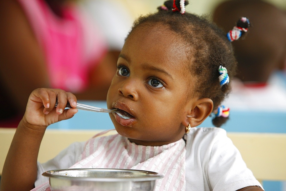 Meal time at a nursery and kindergarten run by Catholic nuns, Lome, Togo, West Africa, Africa