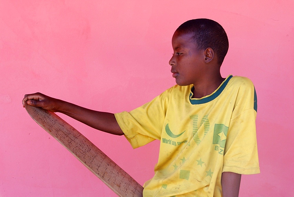 Koranic school pupil holding a prayer tablet, Abene, Casamance, Senegal, West Africa, Africa