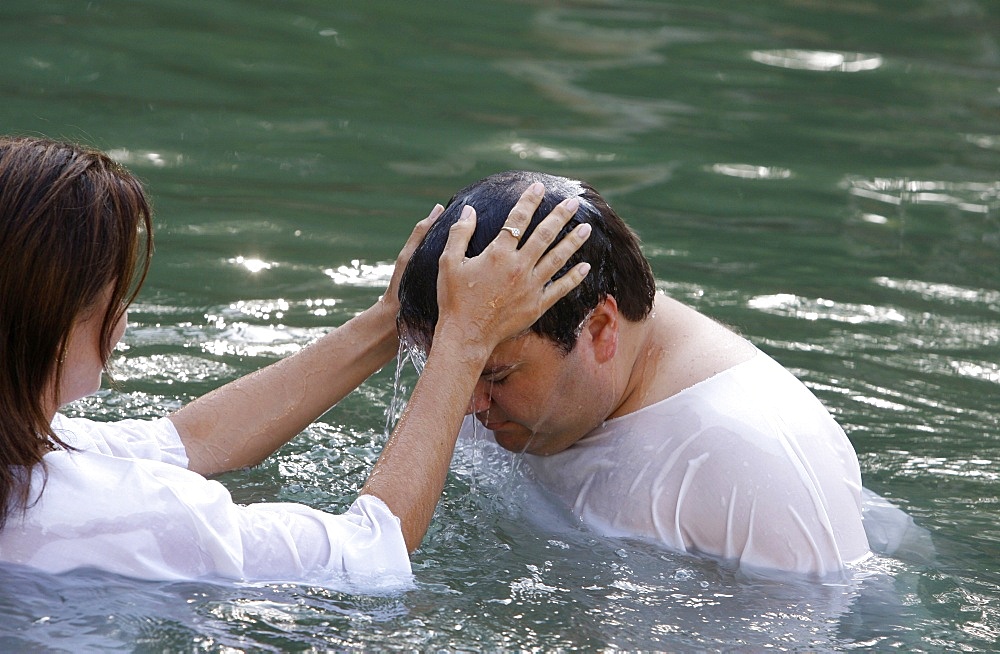 Pilgrim's baptism in the Jordan River, Yardenit, Israel, Middle East