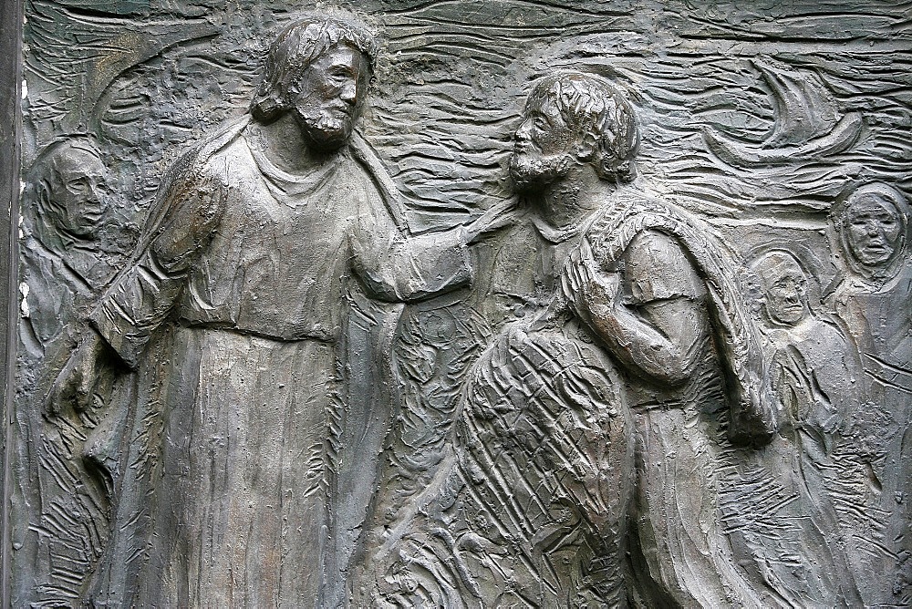 Sculpture of the calling of St. Peter on the Notre Dame door, Saint-Pierre de Montmartre church, Paris, France, Europe