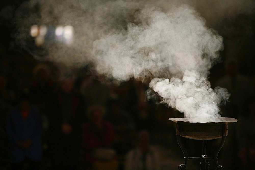 Incense burning in Paris cathedral, Paris, France, Europe