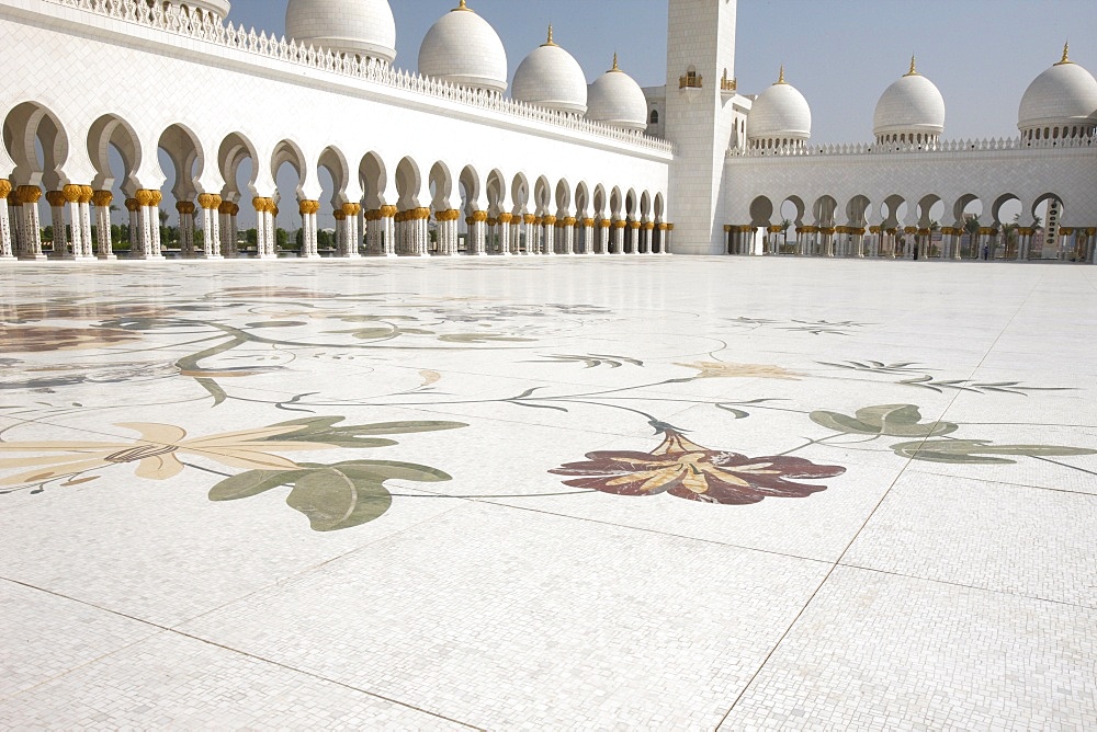 Colored floral marble and mosaics used as paving in the courtyard of 17,000 square metres, Sheikh Zayed Grand Mosque, Abu Dhabi, United Arab Emirates, Middle East