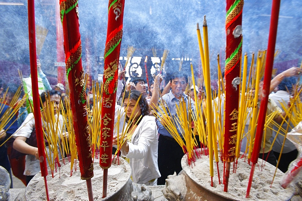 Burning incense during Tet, the Vietnamese lunar New Year celebration, Thien Hau Temple, Ho Chi Minh City, Vietnam, Indochina, Southeast Asia, Asia