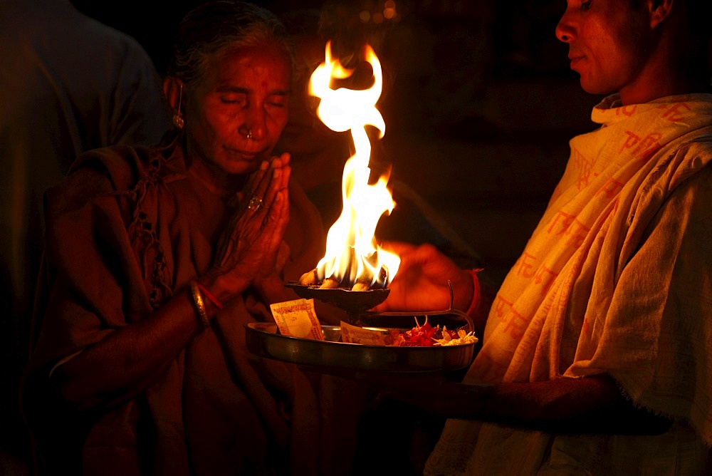 Priest and devotee performing aarti, Haridwar, Uttarakhand, India, Asia