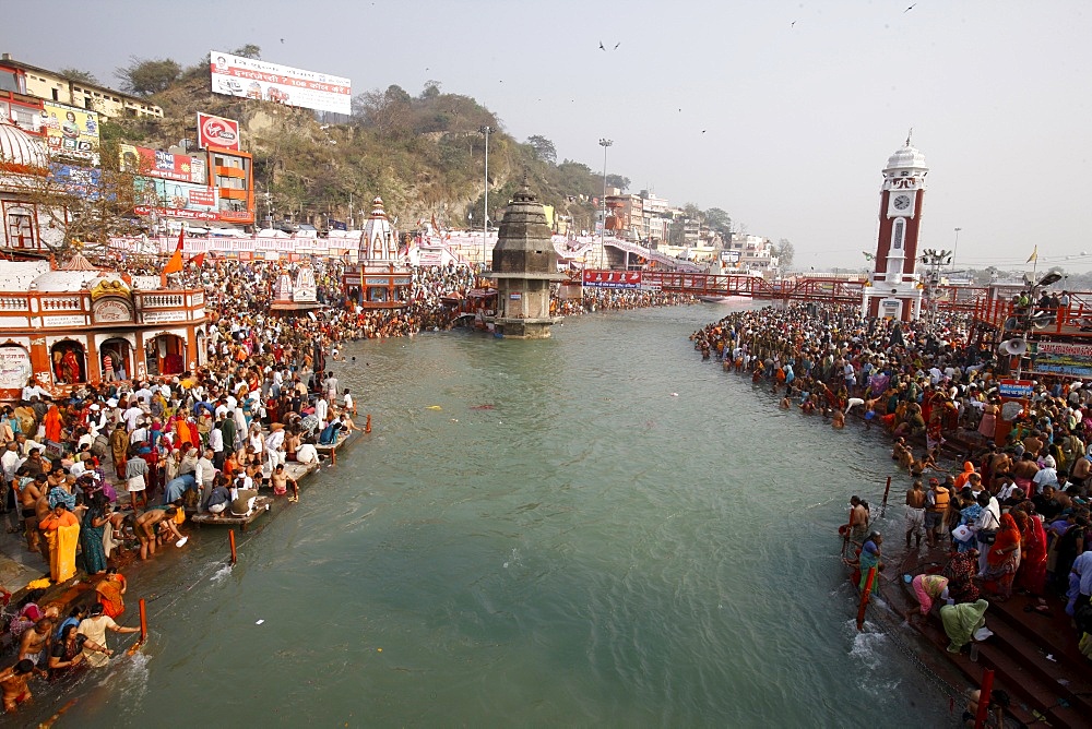 Thousands of devotees converge to take a dip in the River Ganges at Navsamvatsar, a Hindu holiday during the Maha Kumbh Mela festival, Haridwar, Uttarakhand, India, Asia