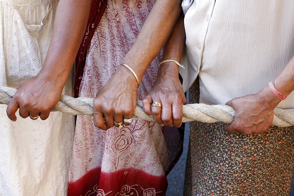 Devotees pulling the rope of the giant chariot carrying Lord Krishna, Ratha Yatra Chariot festival, Paris, France, Europe