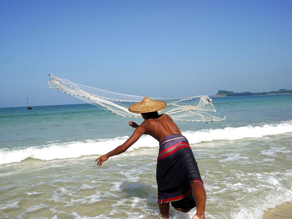 Fisherman throwing his net, Ngapali, Myanmar, Asia