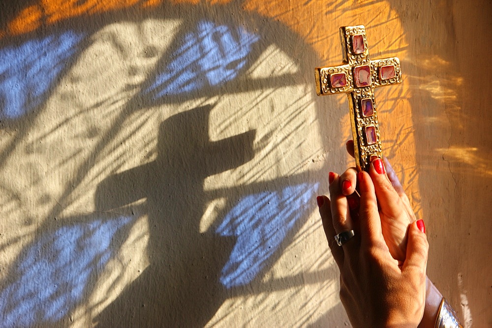 Woman holding a cross, Servoz, Haute-Savoie, France, Europe