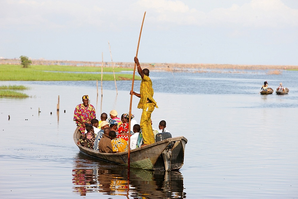 Boat with passengers, near Ganvie lake village on Nokoue Lake, Benin, West Africa, Africa