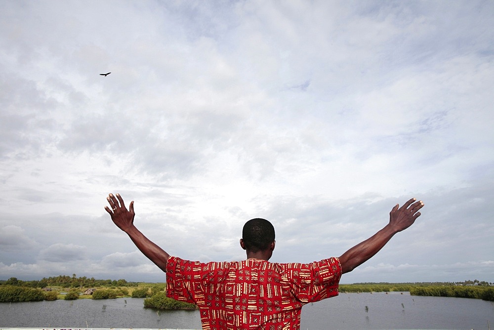 African man watching the sky, Ouidah, Benin, West Africa, Africa