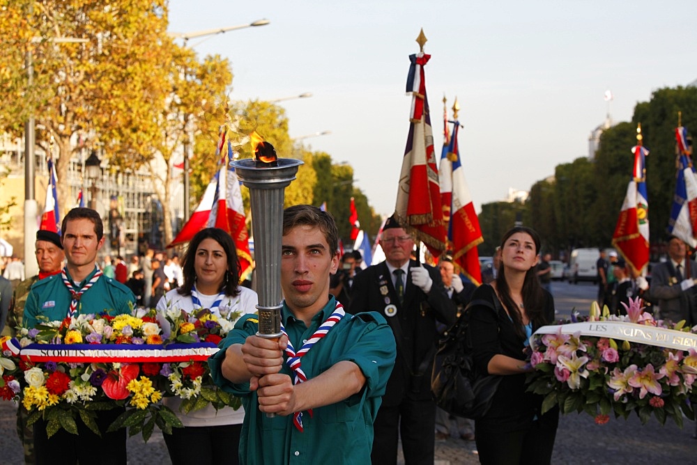 French Muslims carrying a torch to the Arc de Triomphe, Paris, France, Europe