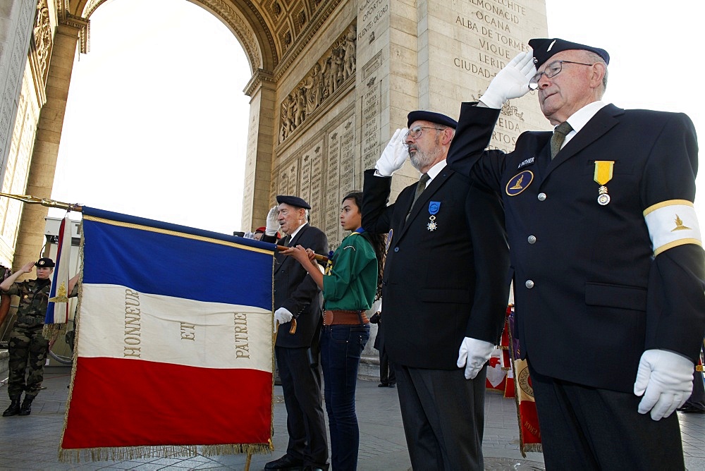 French Muslim girl scout and war veterans at the Arc de Triomphe, Paris, France, Europe